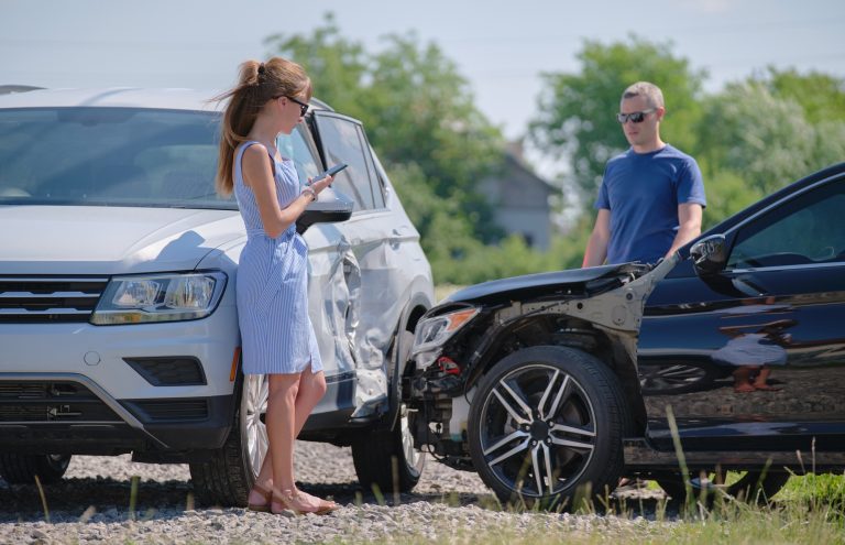 Two drivers having argument over who is guilty in car crash accident.
